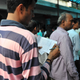 A Hindu devotee marks off the number of